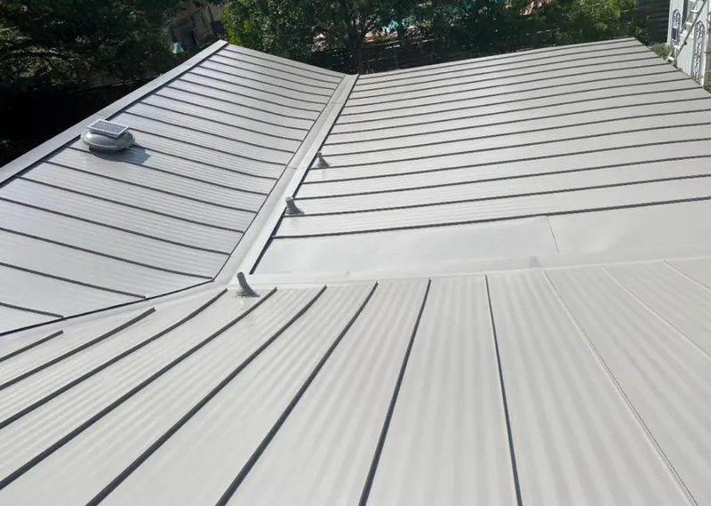 Solar attic fan installed on a metal roof for Roof Ventilation in Yreka